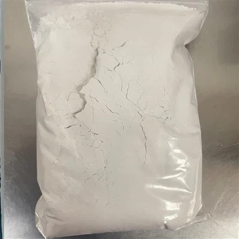 Poudre composite alcaline